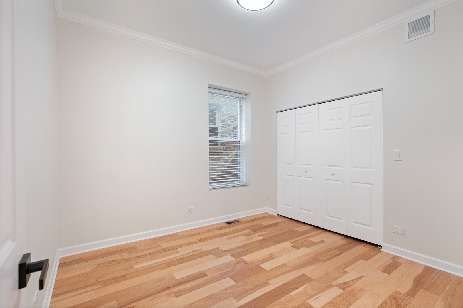 2315 West Rice Street, Unit 1N Chicago, IL 60622 - Photo 21 of 37 a view of empty room with wooden floor