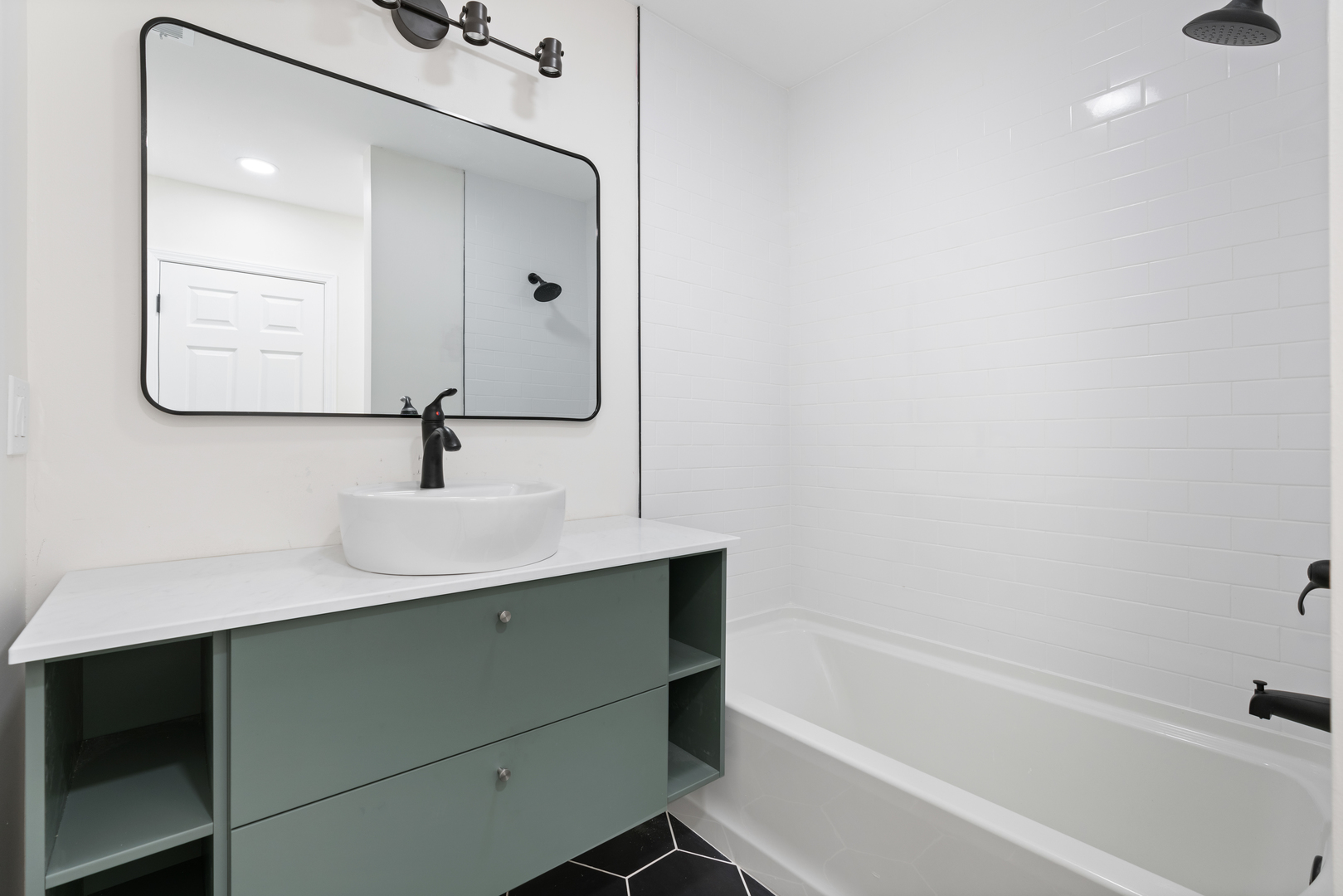 2315 West Rice Street, Unit 1N Chicago, IL 60622 - Photo 31 of 37 a bathroom with a sink and a mirror