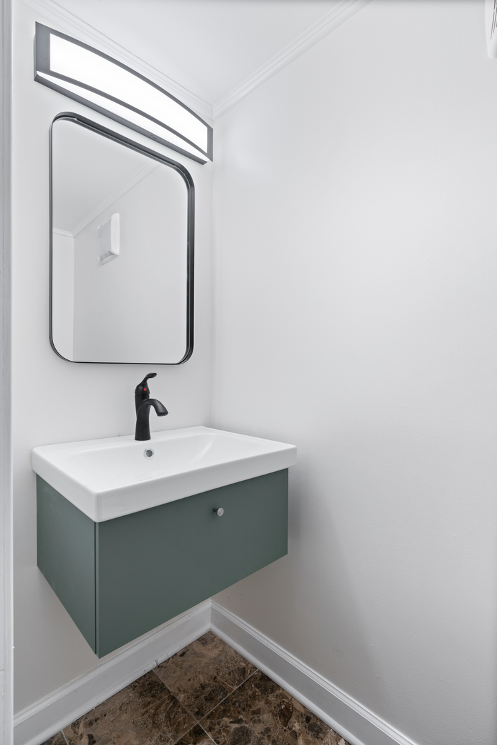 2315 West Rice Street, Unit 1N Chicago, IL 60622 - Photo 34 of 37 a bathroom with a sink and mirror