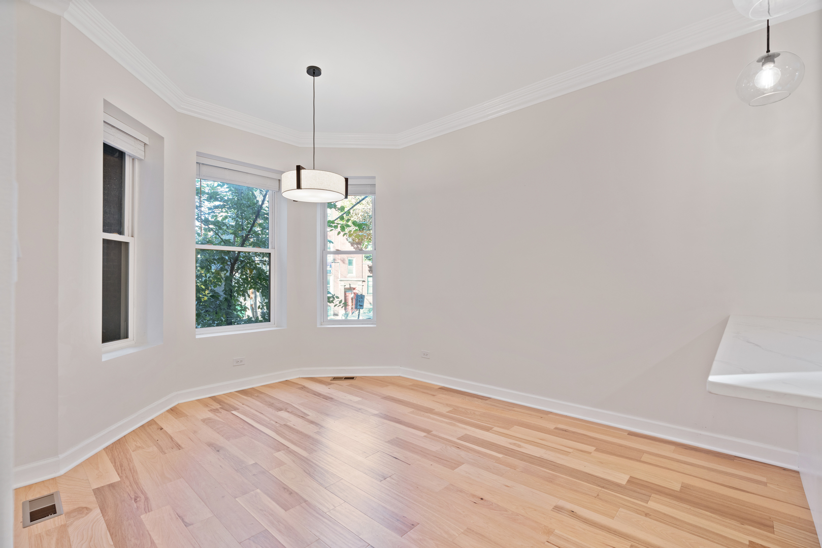 2315 West Rice Street, Unit 1N Chicago, IL 60622 - Photo 7 of 37 a view of empty room with wooden floor and fan