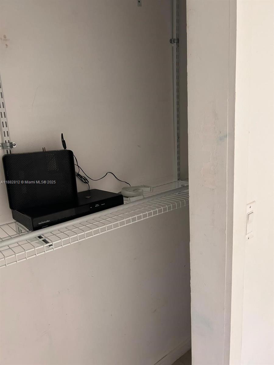 1601 Meridian Avenue, Unit 202 Miami Beach, FL 33139 - Photo 11 of 16 a black refrigerator freezer sitting in a field