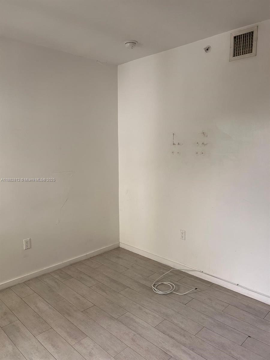 1601 Meridian Avenue, Unit 202 Miami Beach, FL 33139 - Photo 15 of 16 a view of an empty room