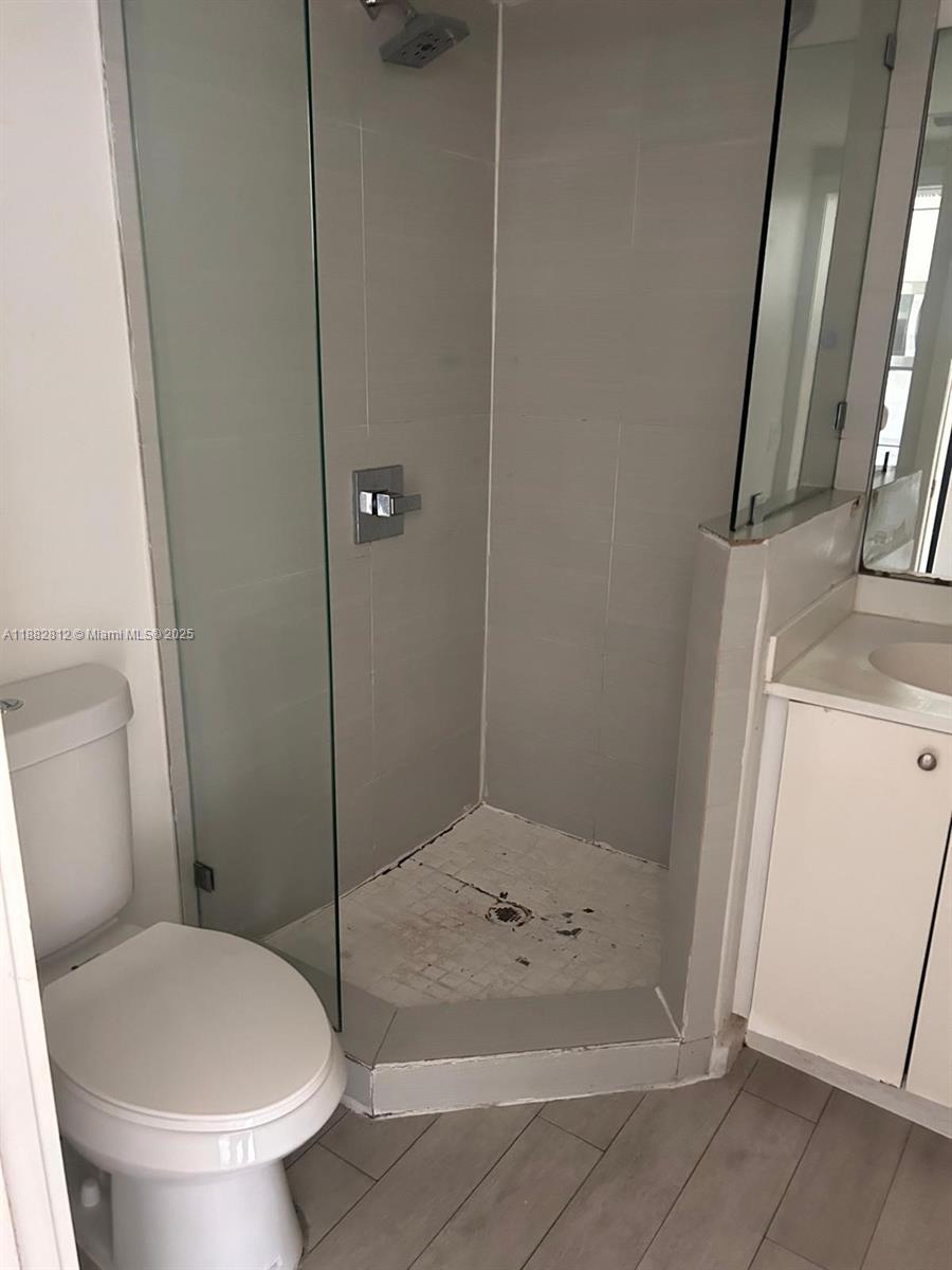 1601 Meridian Avenue, Unit 202 Miami Beach, FL 33139 - Photo 10 of 16 a bathroom with a toilet and a shower