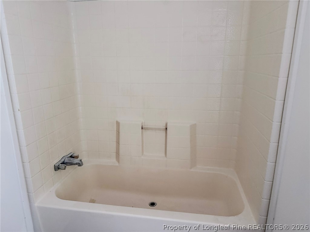 898 Brisson Road St. Pauls, NC 28384 - Photo 11 of 18 a close up of a bathtub