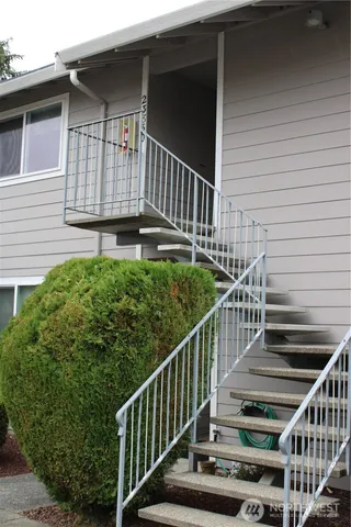 a view of balcony with deck and wooden floor