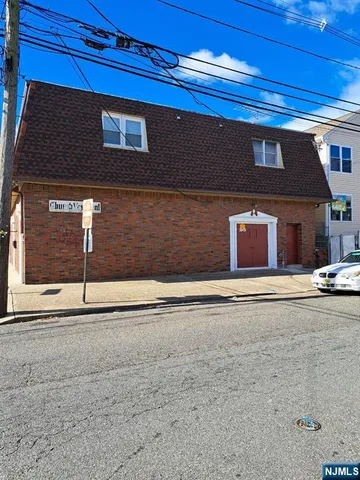 a view of a cars parked on the side of a street