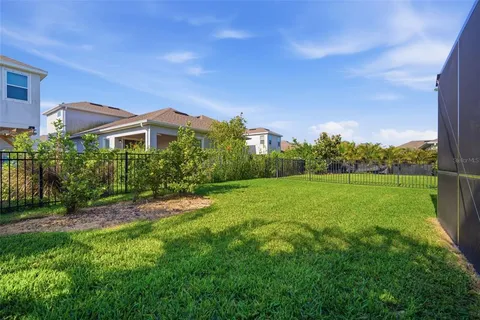 an aerial view of a house with swimming pool garden and outdoor seating