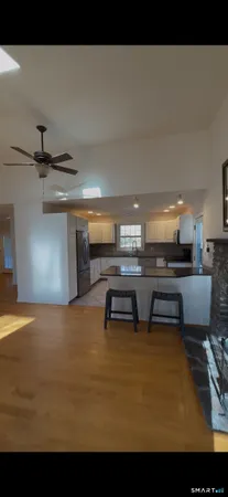 a kitchen with kitchen island a counter top space