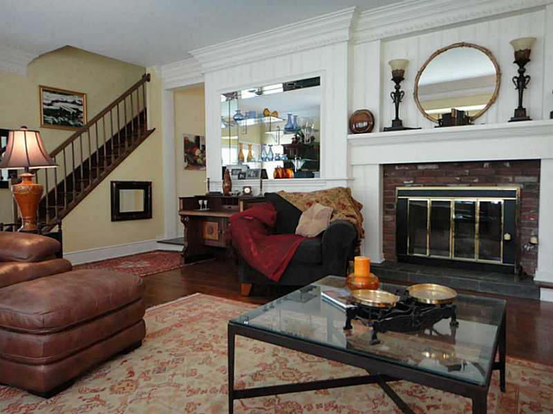 221 Orr Road Upper St. Clair, PA 15241 - Photo 4 of 25 Living Room. View of the formal living room at the fireplace and built-ins and stairs up to the second level