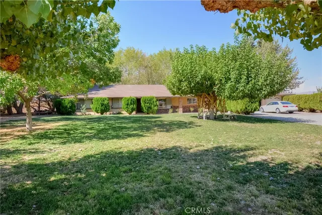 a view of a car parked in front of a house