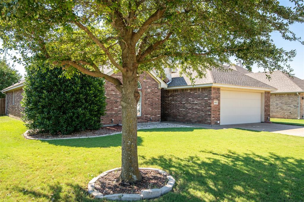 10913 Golfview Way Benbrook, TX 76126 - Photo 2 of 19 a front view of a house with a yard