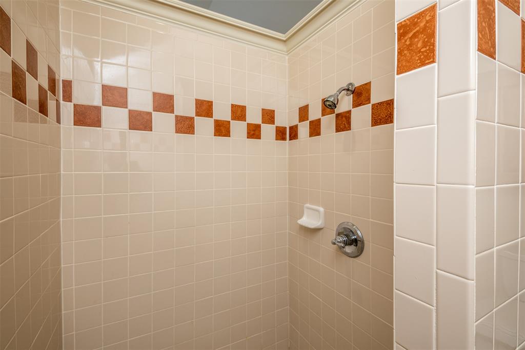 10913 Golfview Way Benbrook, TX 76126 - Photo 5 of 19 a bathroom with a black and white shower curtain