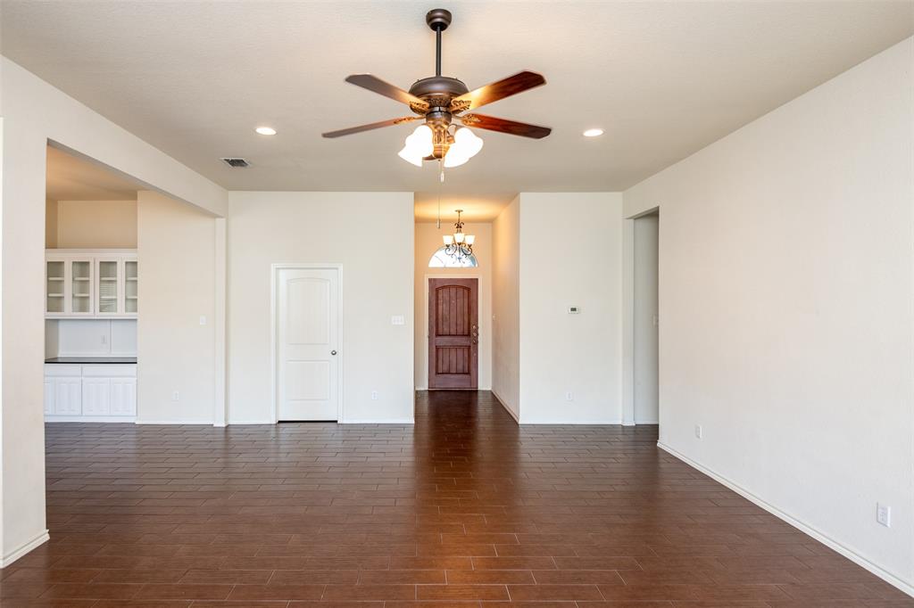 10913 Golfview Way Benbrook, TX 76126 - Photo 8 of 19 a view of an empty room with window and wooden floor