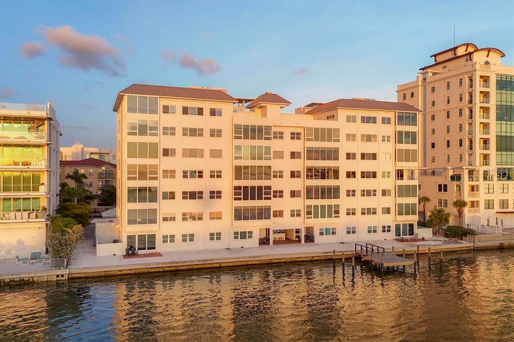 226 Golden Gate Point, Unit 12 Sarasota, FL 34236 - Photo 11 of 52 a view of swimming pool with outdoor seating and lake view