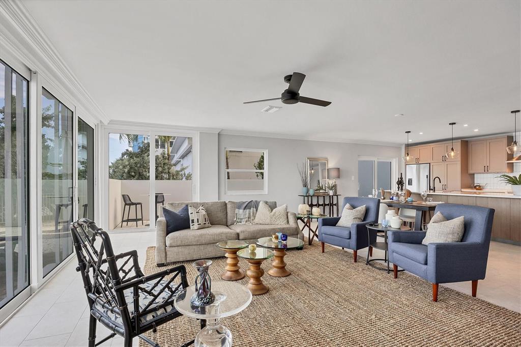 226 Golden Gate Point, Unit 12 Sarasota, FL 34236 - Photo 21 of 52 a living room with furniture and a large window