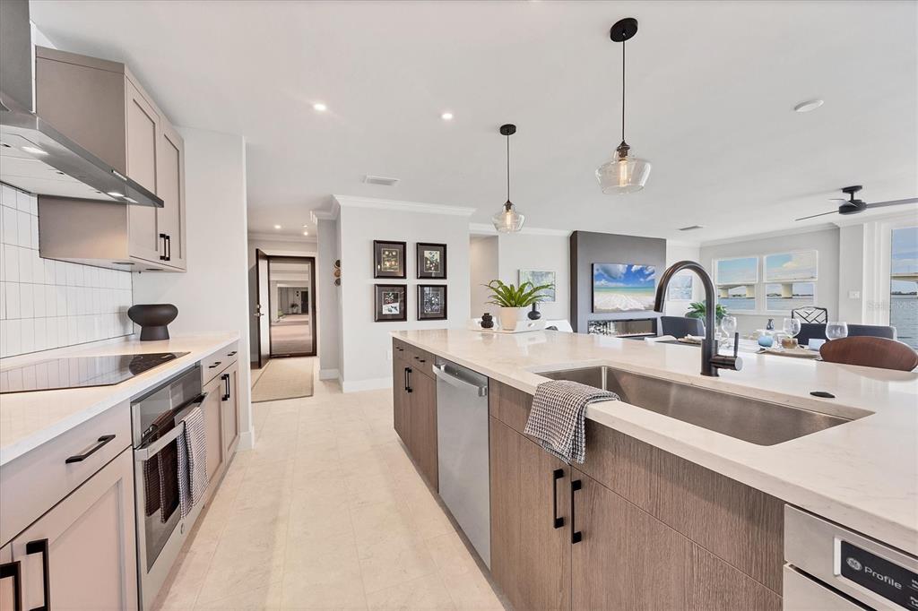226 Golden Gate Point, Unit 12 Sarasota, FL 34236 - Photo 28 of 52 a kitchen with counter top space sink and stove