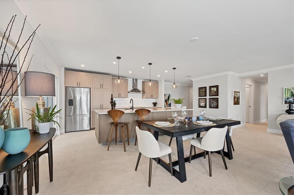 226 Golden Gate Point, Unit 12 Sarasota, FL 34236 - Photo 30 of 52 a view of a dining room with furniture