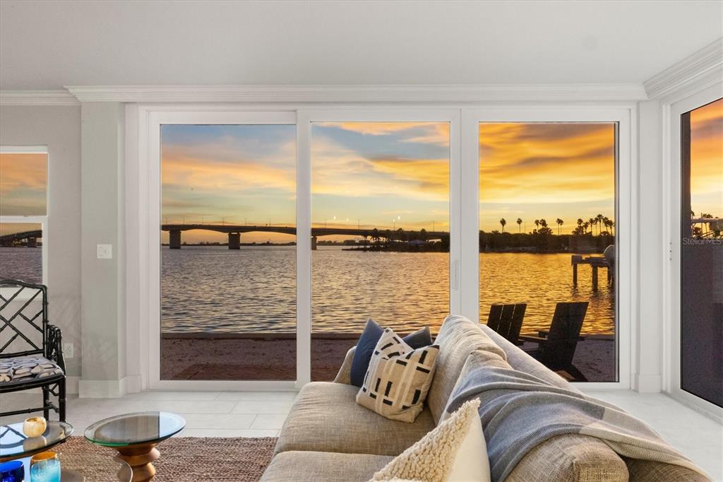 226 Golden Gate Point, Unit 12 Sarasota, FL 34236 - Photo 5 of 52 a living room with furniture and floor to ceiling windows