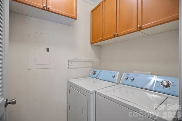 a spacious bedroom with a bed and a couch