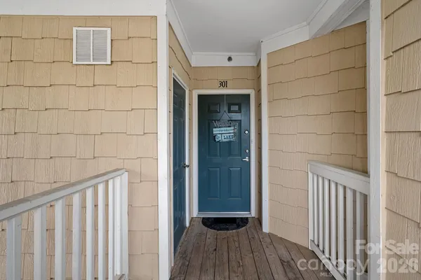 a view of a wooden door and wooden floor