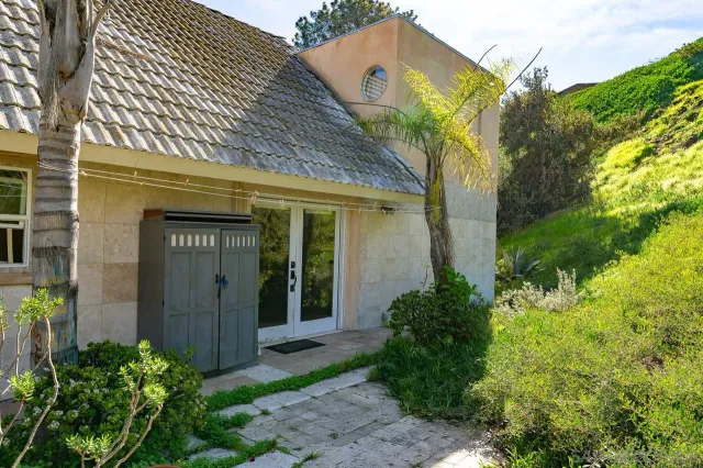 a view of a house with a small yard