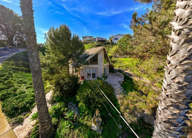 a view of a house with a tree