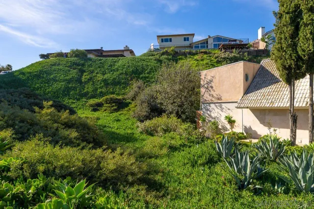 an aerial view of a house with yard and outdoor seating