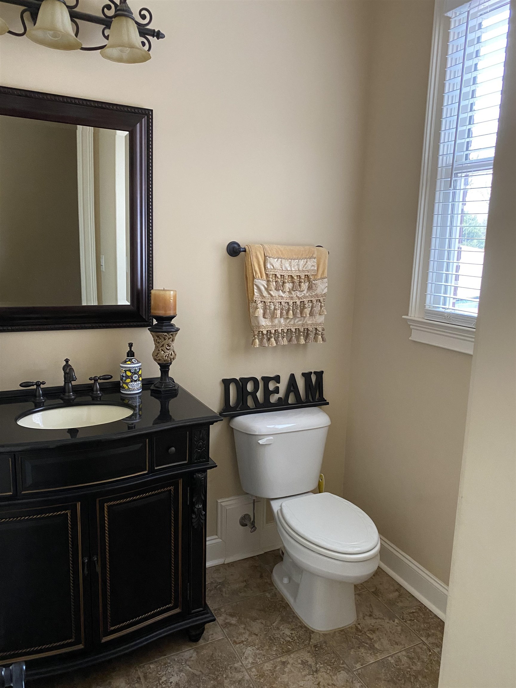 930 Snowden Farm Road Collierville, TN 38017 - Photo 19 of 38 a bathroom with a granite countertop toilet sink and mirror