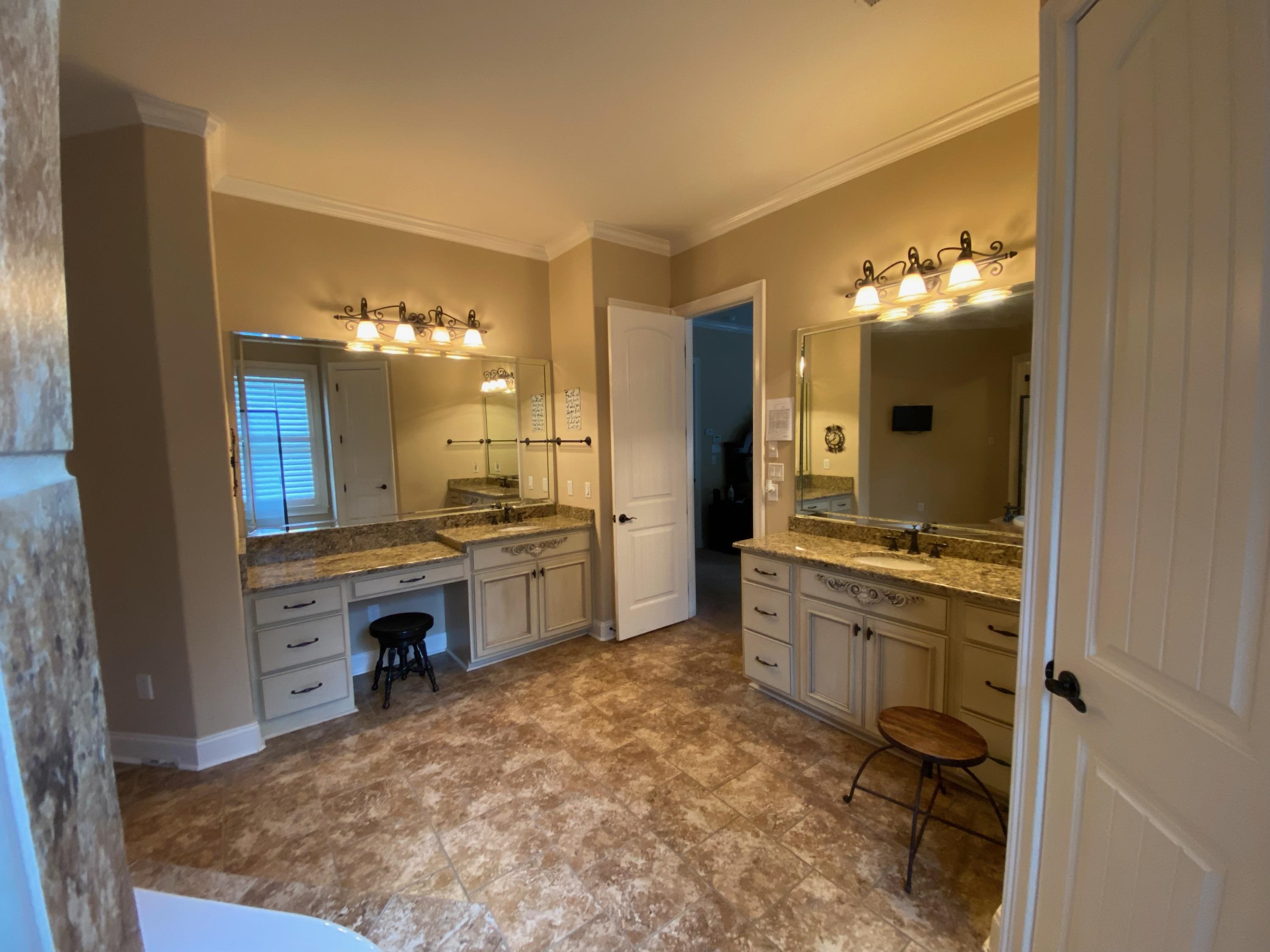 930 Snowden Farm Road Collierville, TN 38017 - Photo 23 of 38 a bathroom with a sink vanity and a mirror