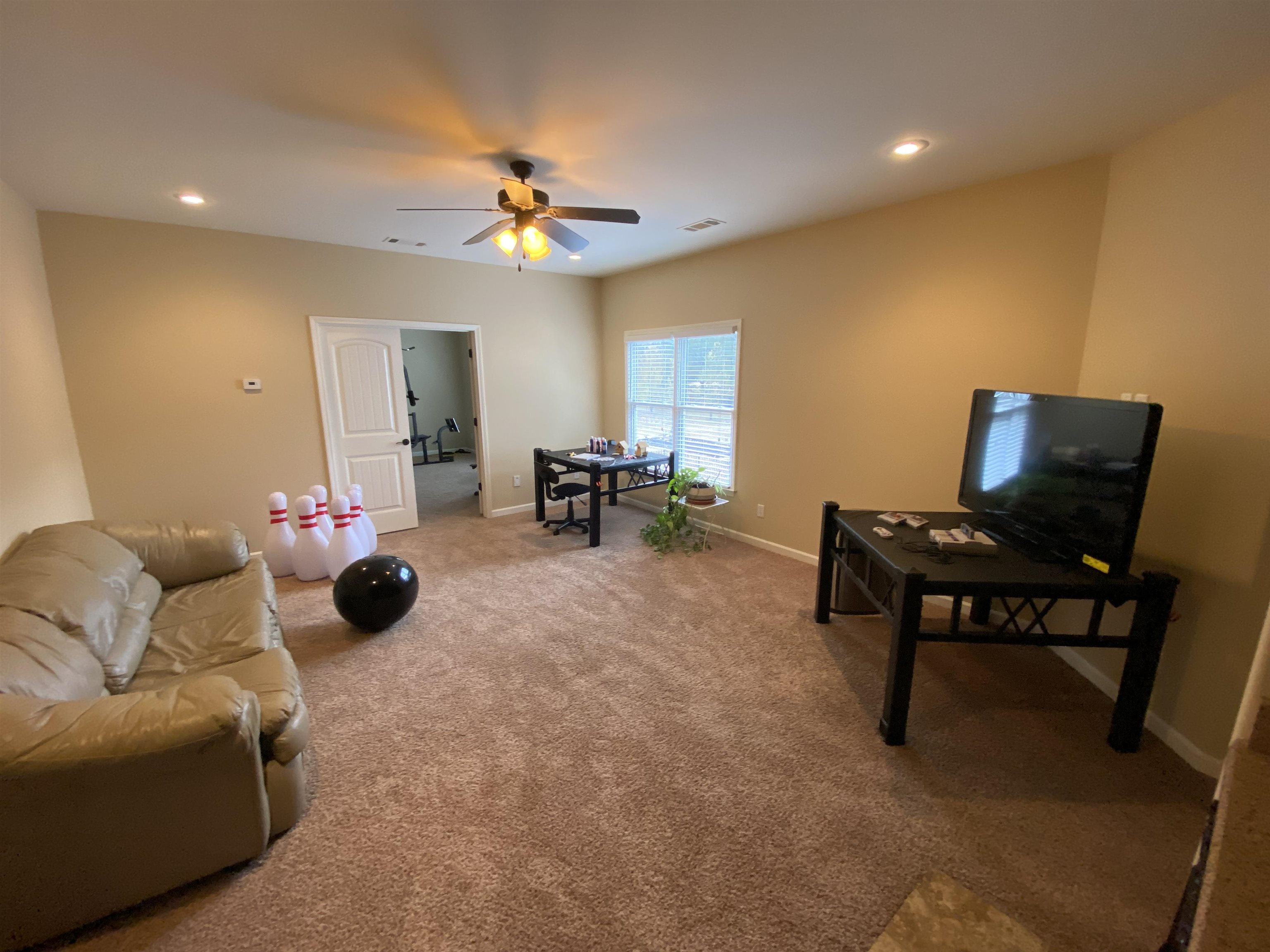 930 Snowden Farm Road Collierville, TN 38017 - Photo 28 of 38 a living room with furniture and a chandelier