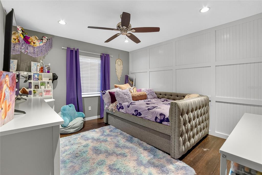 3309 Timberlee Road Wimauma, FL 33598 - Photo 12 of 55 a bedroom with a bed window and couch