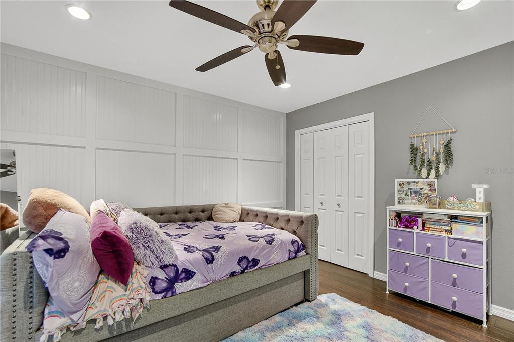 3309 Timberlee Road Wimauma, FL 33598 - Photo 13 of 55 a bedroom with a bed and a dresser in it