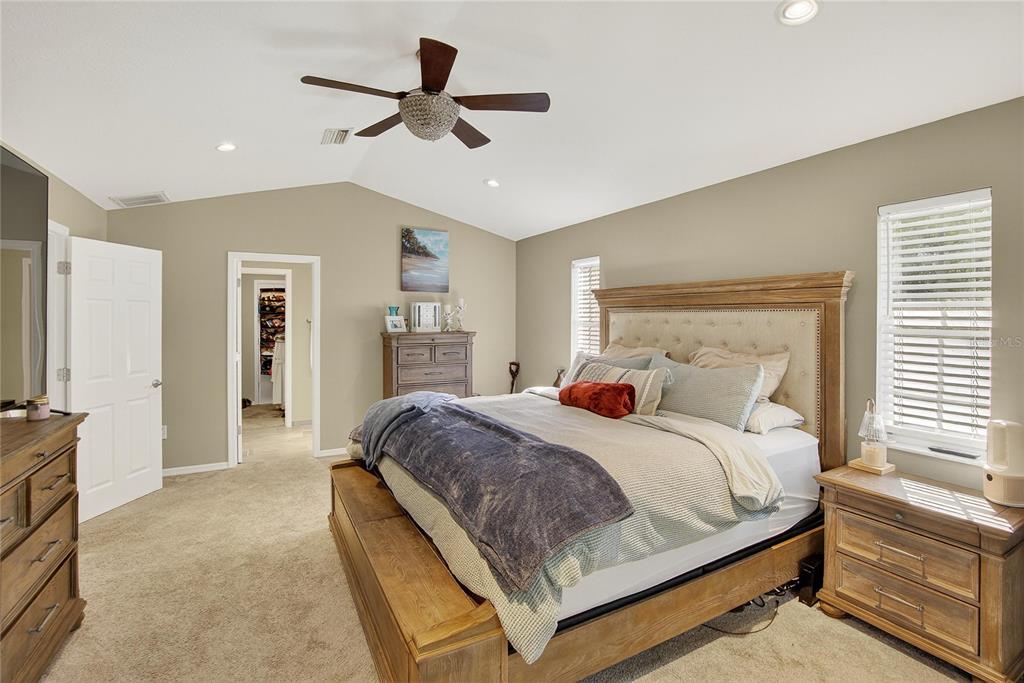 3309 Timberlee Road Wimauma, FL 33598 - Photo 18 of 55 a bedroom with a bed and a chandelier