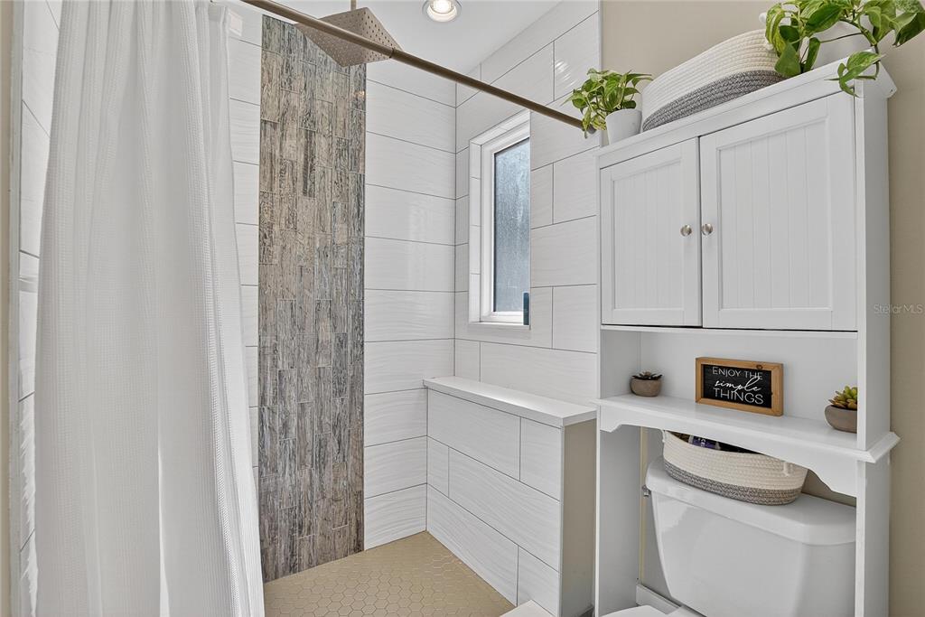 3309 Timberlee Road Wimauma, FL 33598 - Photo 20 of 55 a bathroom with a sink a toilet and shower