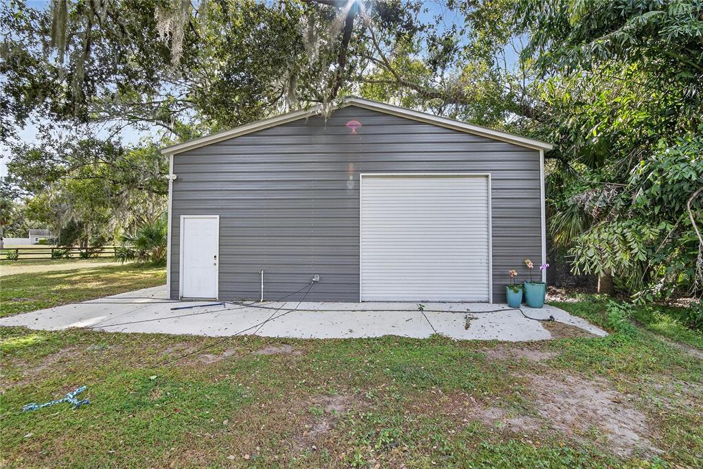 3309 Timberlee Road Wimauma, FL 33598 - Photo 33 of 55 a backyard of a house with lots of green space