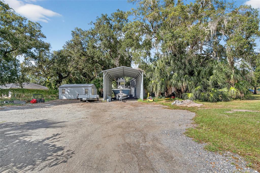 3309 Timberlee Road Wimauma, FL 33598 - Photo 37 of 55 a front view of a house with a yard and garage