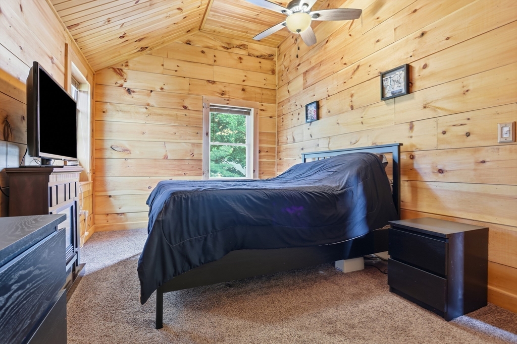 2 Cashman Road Peabody, MA 01960 - Photo 18 of 37 a bedroom with a bed and flat screen tv