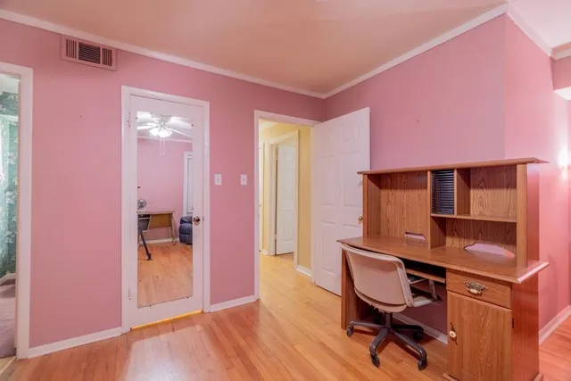 a workspace with furniture and window