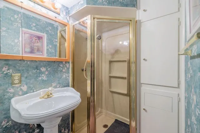 a bathroom with a sink and a mirror