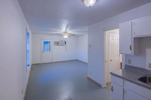 a view of a kitchen cabinets and a utility room
