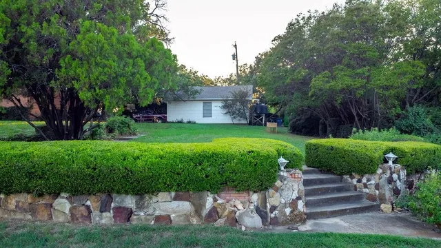 a house view with a garden space
