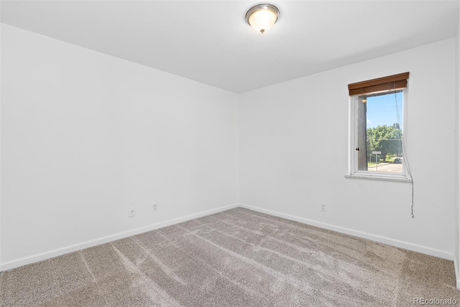 745 Thomas Drive, Unit 2 Boulder, CO 80303 - Photo 23 of 30 an empty room with a window