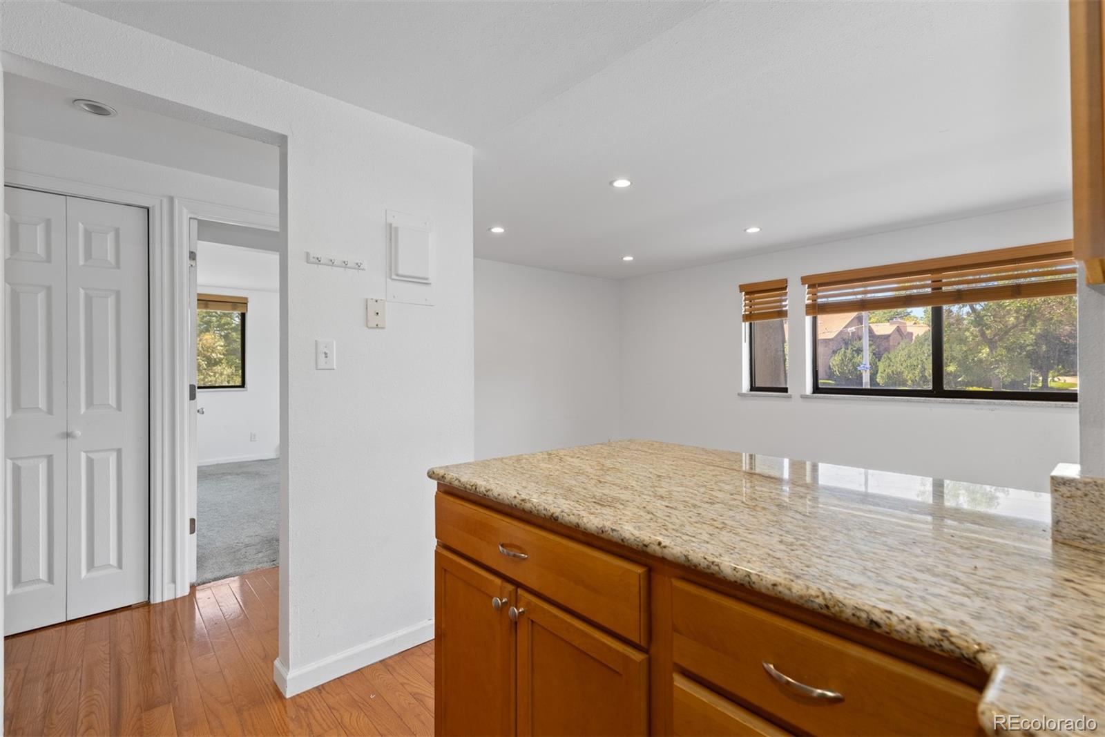 745 Thomas Drive, Unit 2 Boulder, CO 80303 - Photo 9 of 30 a view of hallway with wooden floor and cabinet