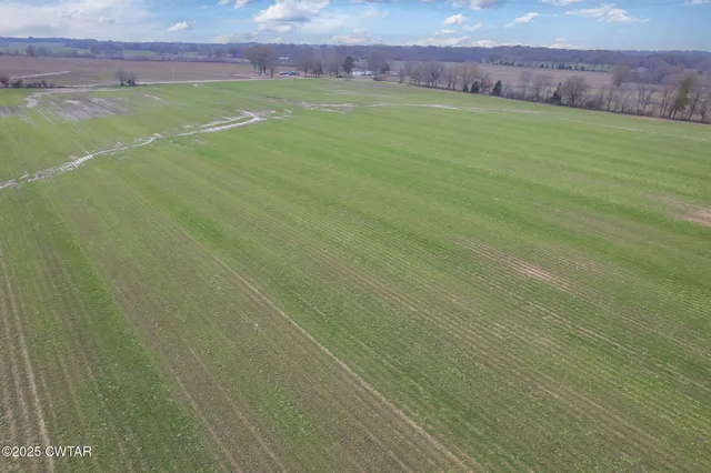 a view of a field with an outdoor space