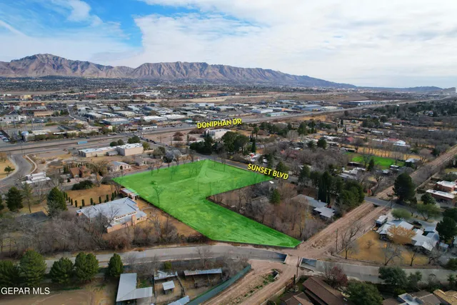 an aerial view of residential houses and outdoor space