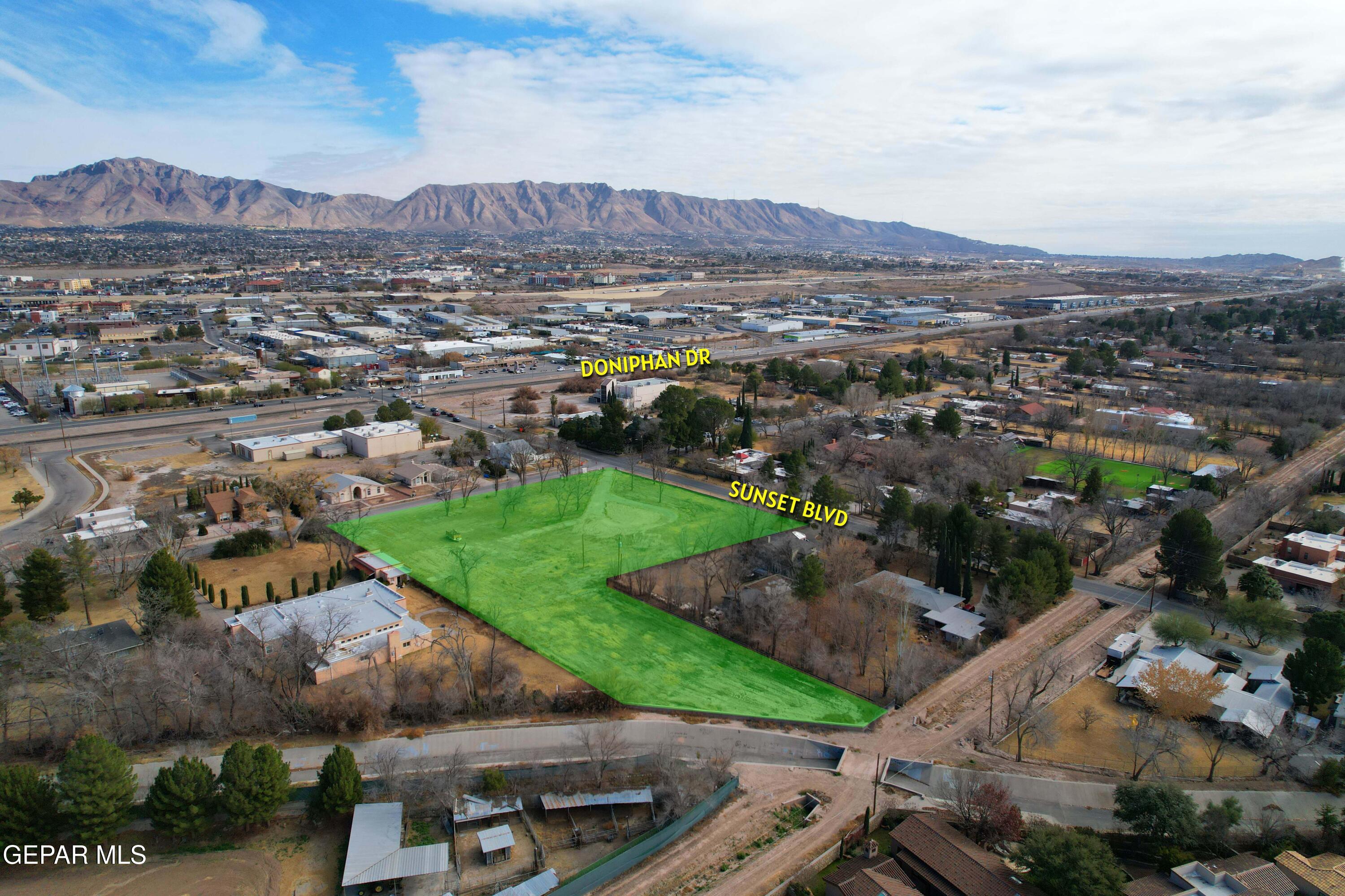 201 West Sunset Road El Paso, TX 79922 - Photo 1 of 8 an aerial view of residential houses and outdoor space