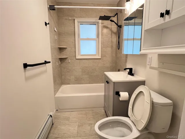 a bathroom with a sink a toilet and bathtub