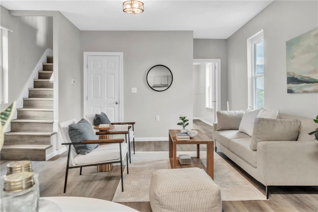 305 1/2 East Lutton Street New Castle, PA 16101 - Photo 11 of 39 a living room with furniture and wooden floor