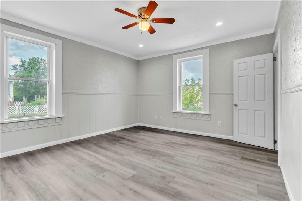 305 1/2 East Lutton Street New Castle, PA 16101 - Photo 14 of 39 wooden floor in an empty room with a window