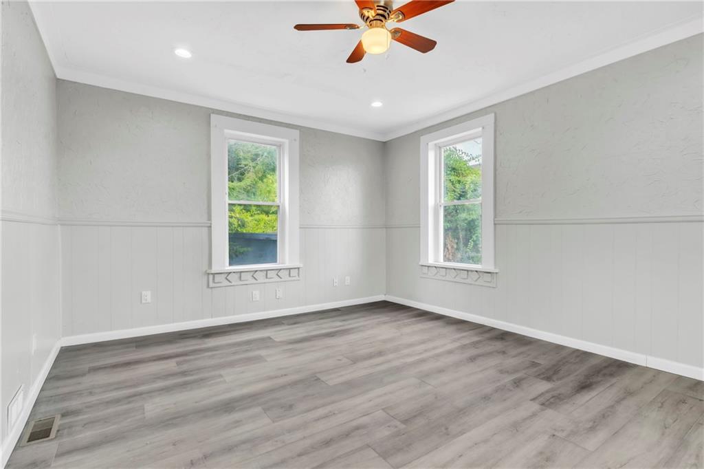 305 1/2 East Lutton Street New Castle, PA 16101 - Photo 15 of 39 a view of an empty room with wooden floor and a window